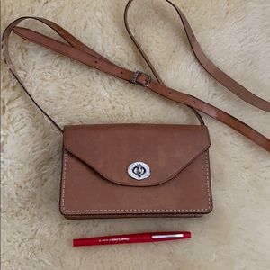 Brown leather clutch